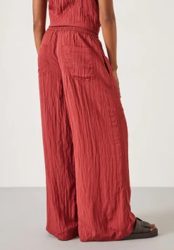 hush Trousers|Mabel Fluid Wide Leg Crinkle Trousers Rust